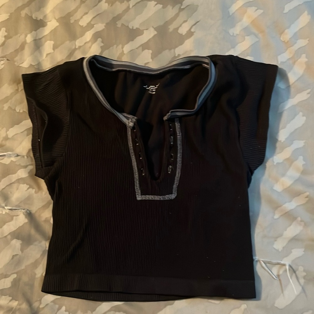 Out from under cropped shirt